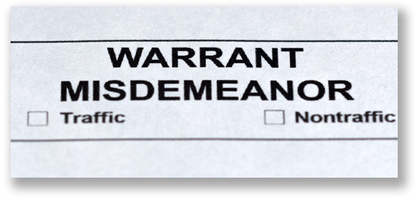 Top of a Michigan court form that's titled warrant misdemeanor and has two checkmark boxes for traffic and nontraffic