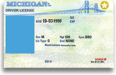 Example of a driver's license in the State of Michigan. It's a white card with the Mackinac Bridge in the background. When this license is suspended, someone must apply for a hardship license to reinstate driving privileges
